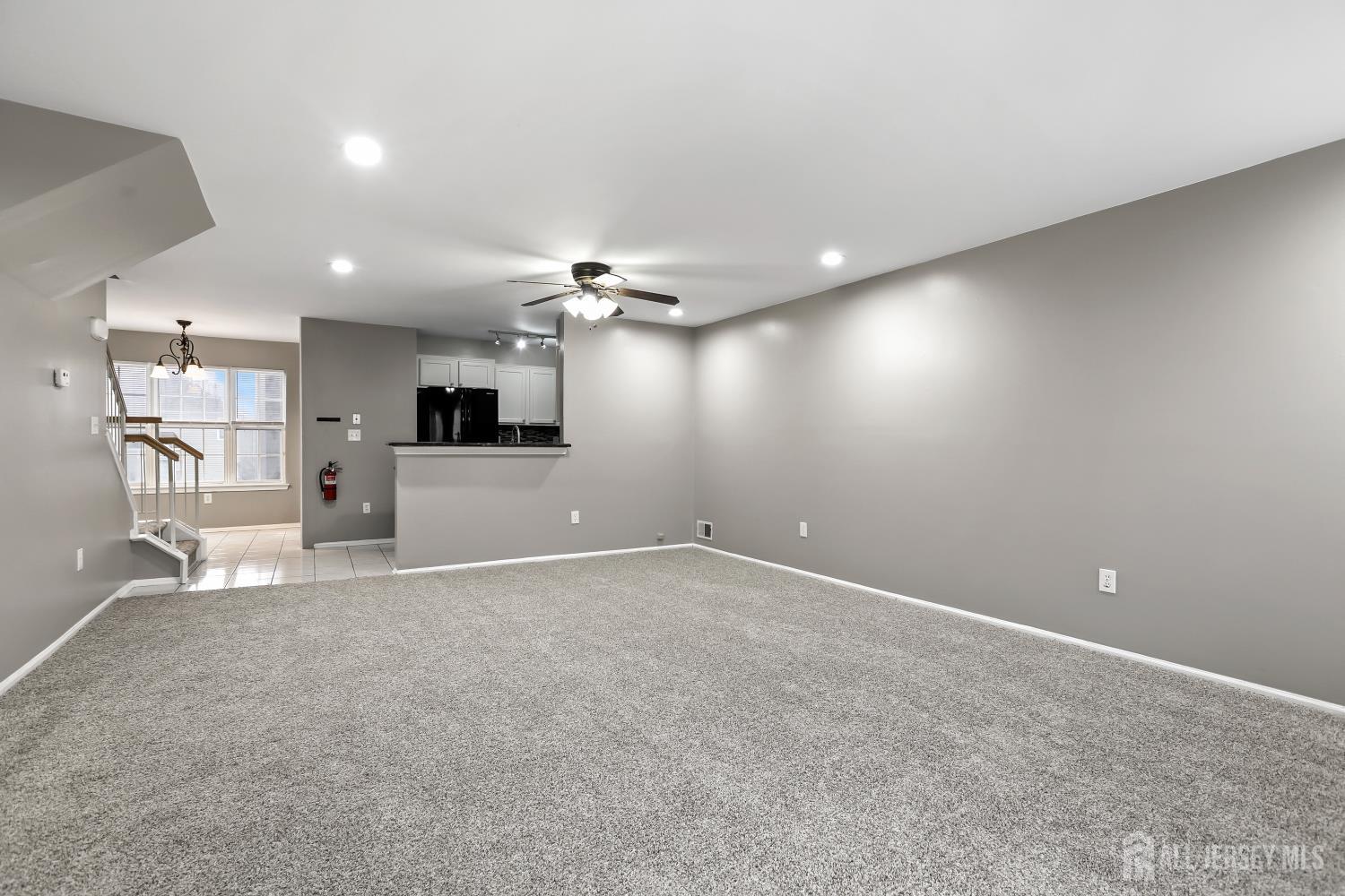 1707 Ridgeview Court Sayreville, NJ 08859 - Photo 5 of 24 a view of a kitchen with a sink and a refrigerator