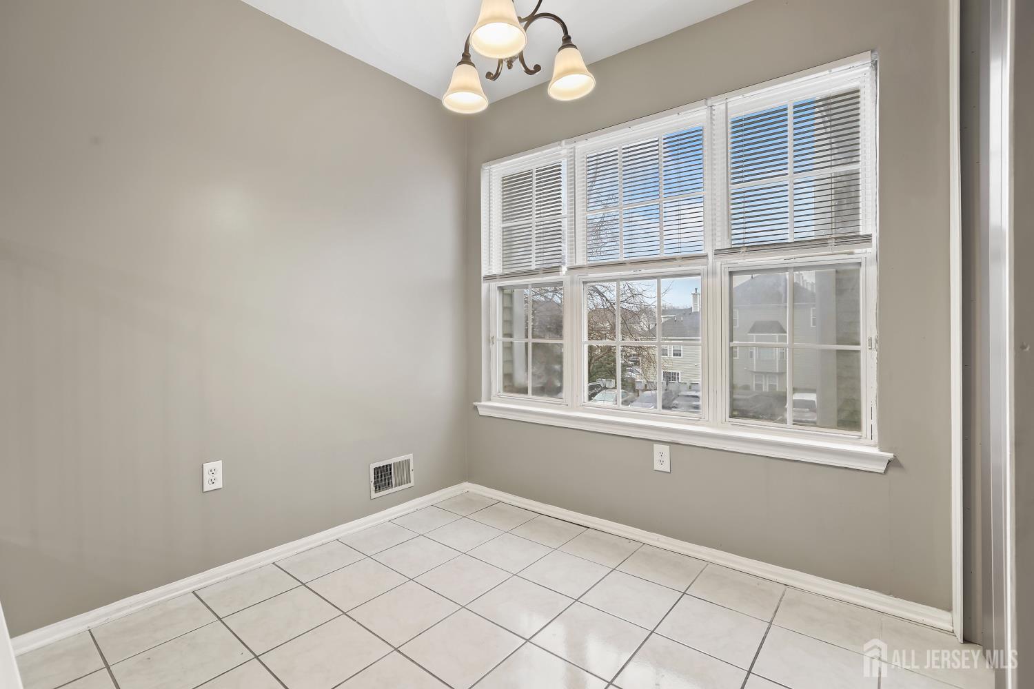1707 Ridgeview Court Sayreville, NJ 08859 - Photo 9 of 24 a view of an empty room with a window