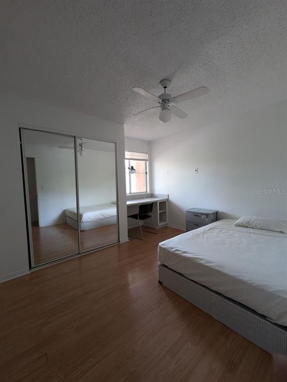 2601 Southwest Archer Road, Unit 203 Gainesville, FL 32608 - Photo 5 of 10 a spacious bedroom with a bed and dresser