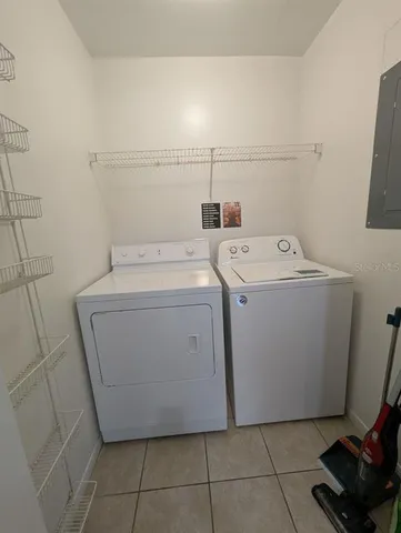 a utility room with dryer and washer