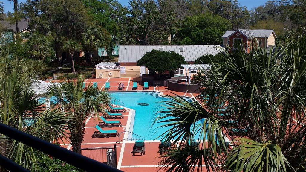 2601 Southwest Archer Road, Unit 203 Gainesville, FL 32608 - Photo 9 of 10 an outdoor space with seating area and trees