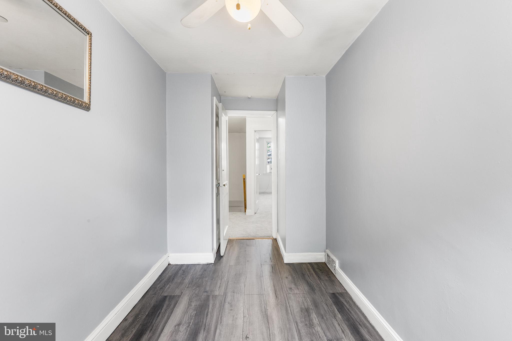 390 Glen Cove Road Collingdale, PA 19023 - Photo 18 of 27 a view of a hallway with wooden floor