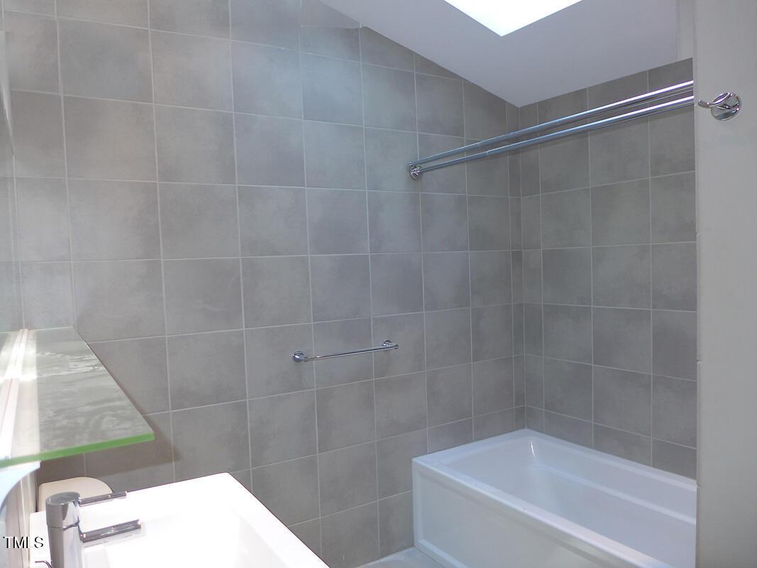 346 Wesley Drive Chapel Hill, NC 27516 - Photo 18 of 24 a bathroom with a bathtub and shower