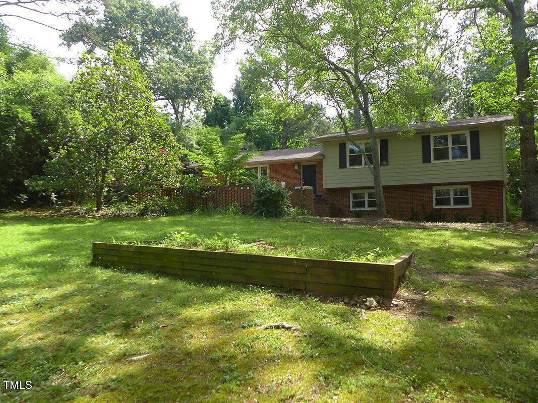 346 Wesley Drive Chapel Hill, NC 27516 - Photo 24 of 24 a front view of a house with a yard