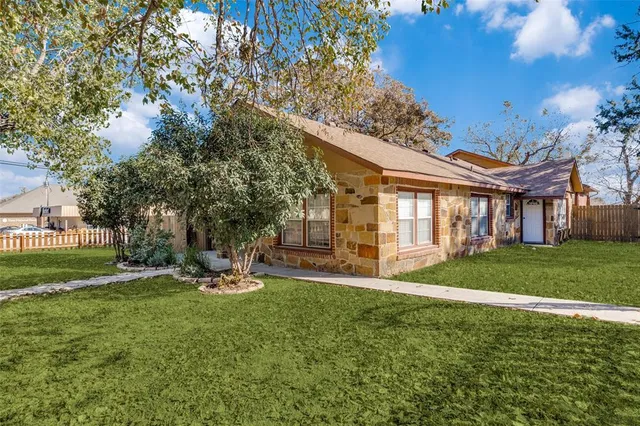 a view of a house with a yard porch and sitting area