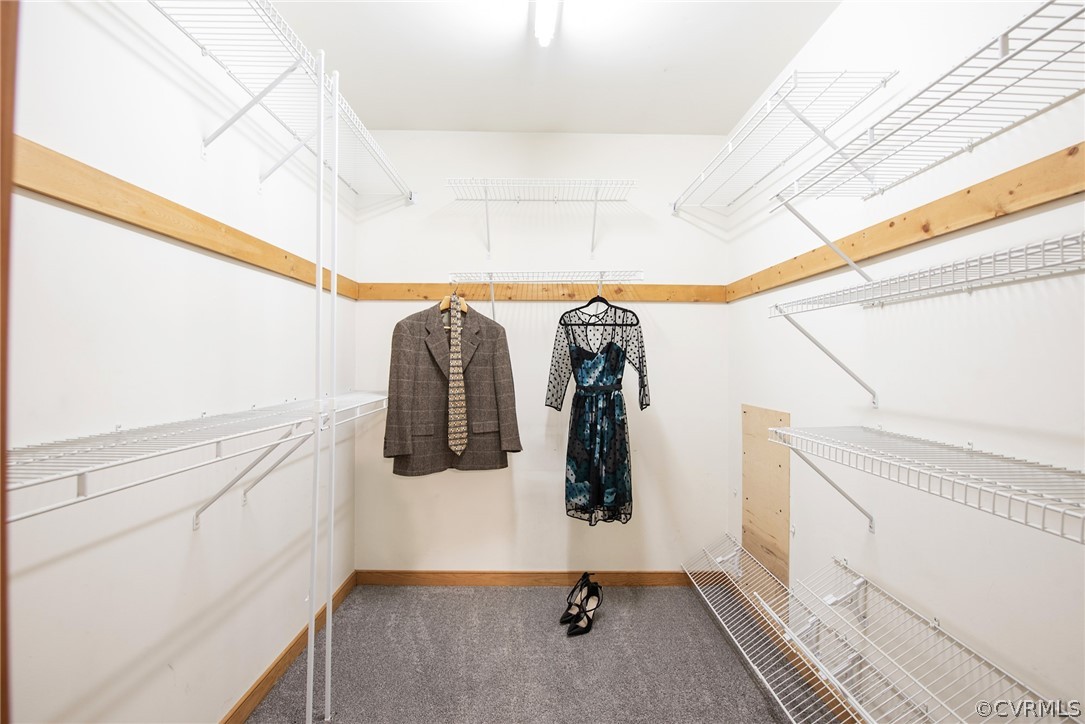 10613 Ridgerun Road Chesterfield, VA 23832 - Photo 28 of 46 a view of walk in closet with clothes and shoes