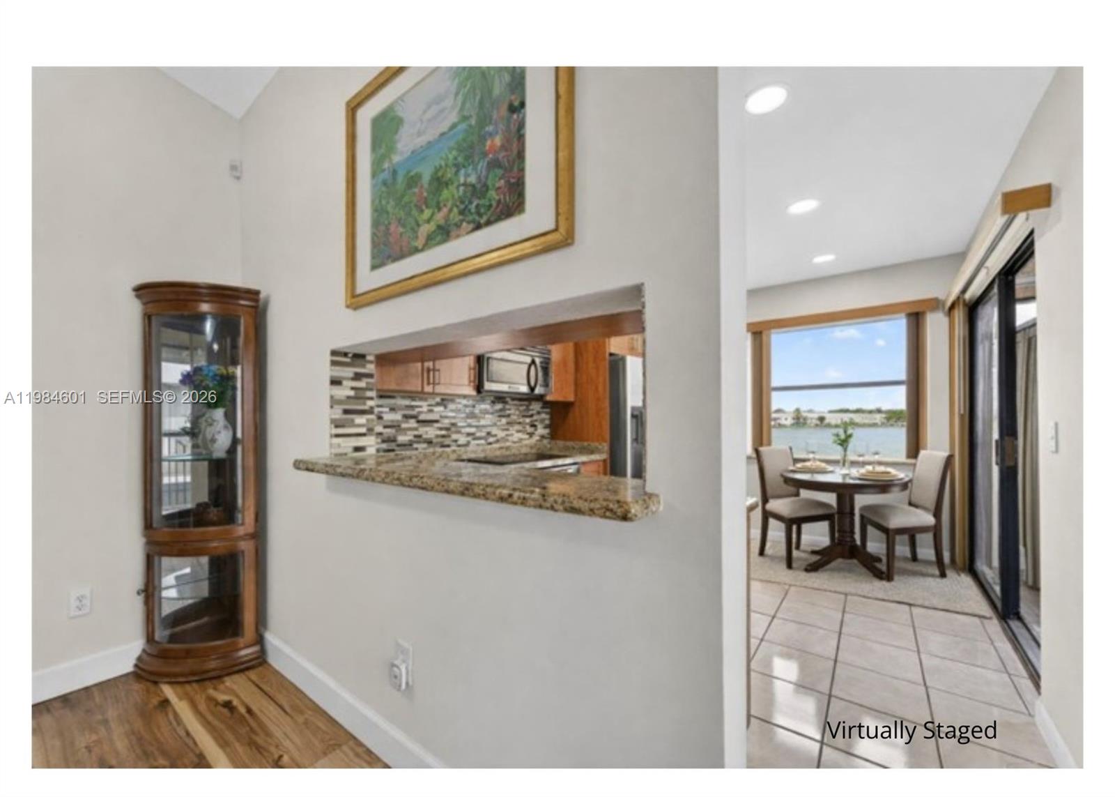 889 Hamilton Drive, Unit 889L Homestead, FL 33034 - Photo 11 of 28 a view of living room with furniture and large window