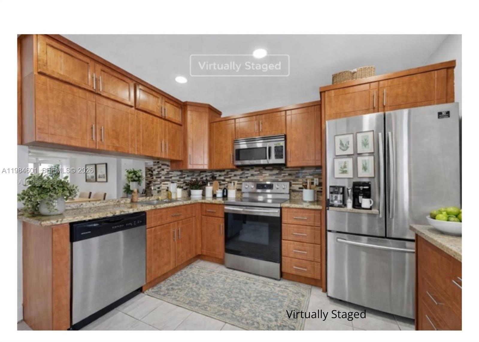 889 Hamilton Drive, Unit 889L Homestead, FL 33034 - Photo 13 of 28 a kitchen with stainless steel appliances granite countertop a refrigerator a stove and a sink