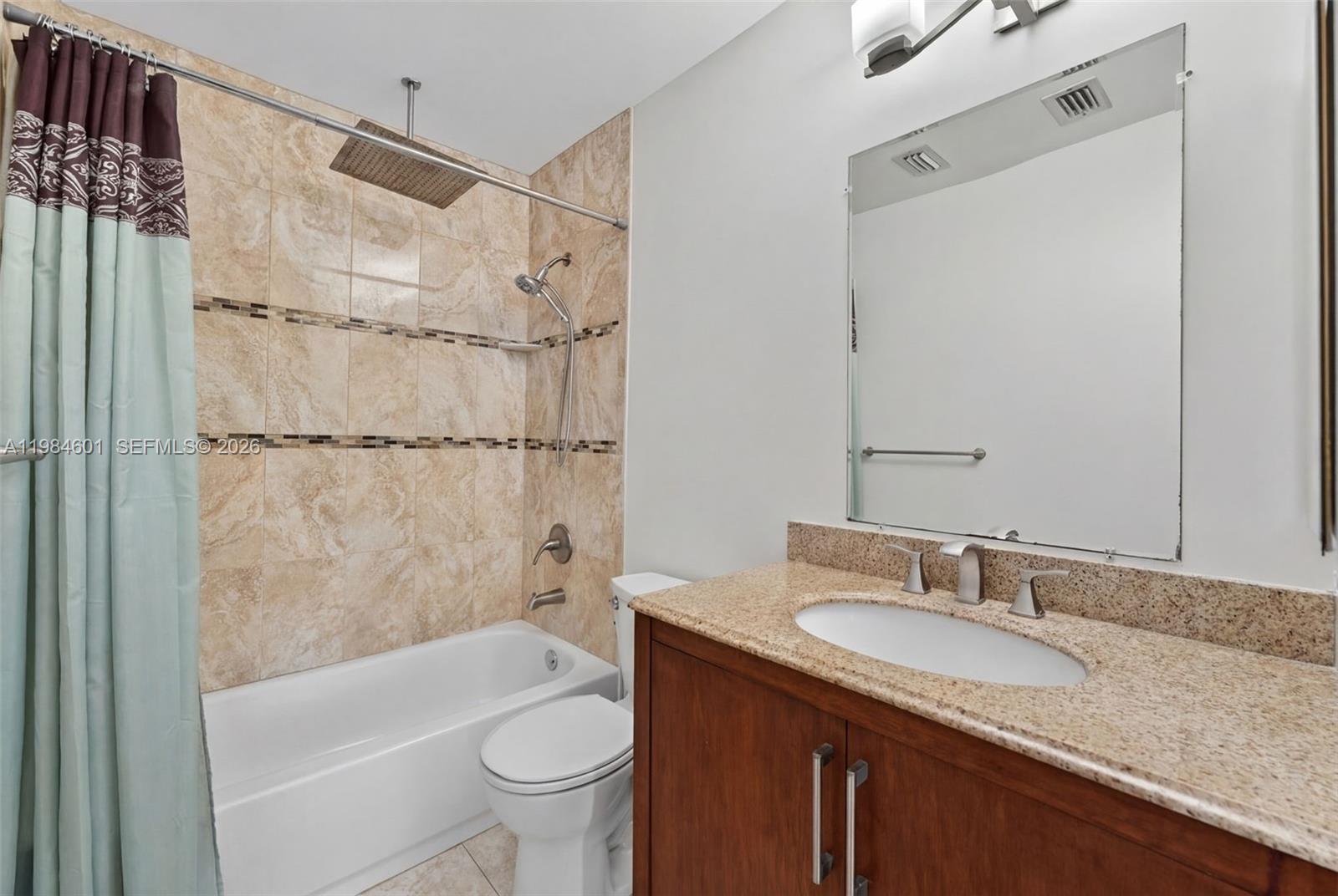 889 Hamilton Drive, Unit 889L Homestead, FL 33034 - Photo 16 of 28 a bathroom with a granite countertop sink toilet and shower