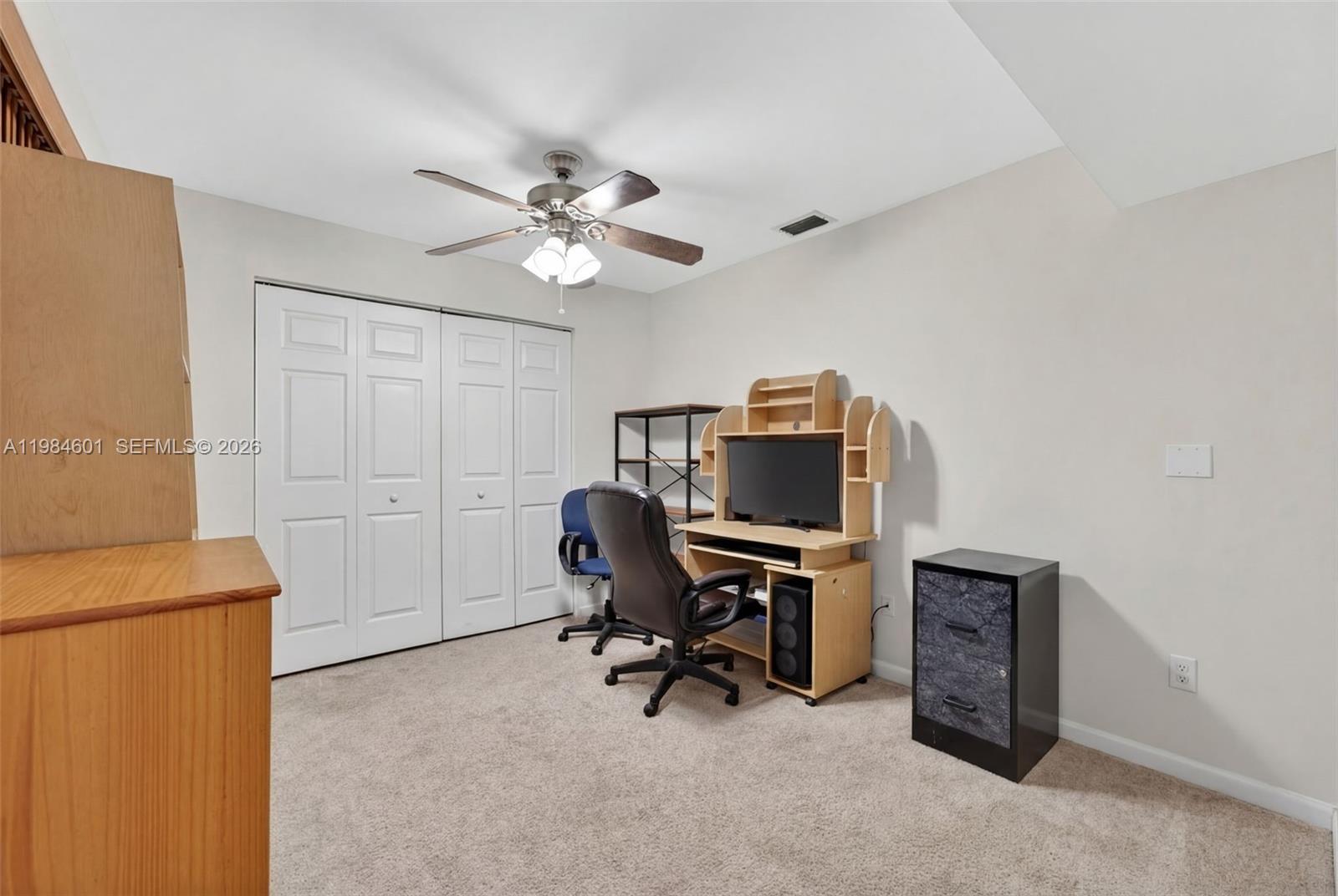 889 Hamilton Drive, Unit 889L Homestead, FL 33034 - Photo 17 of 28 a view of a workspace with furniture and a window