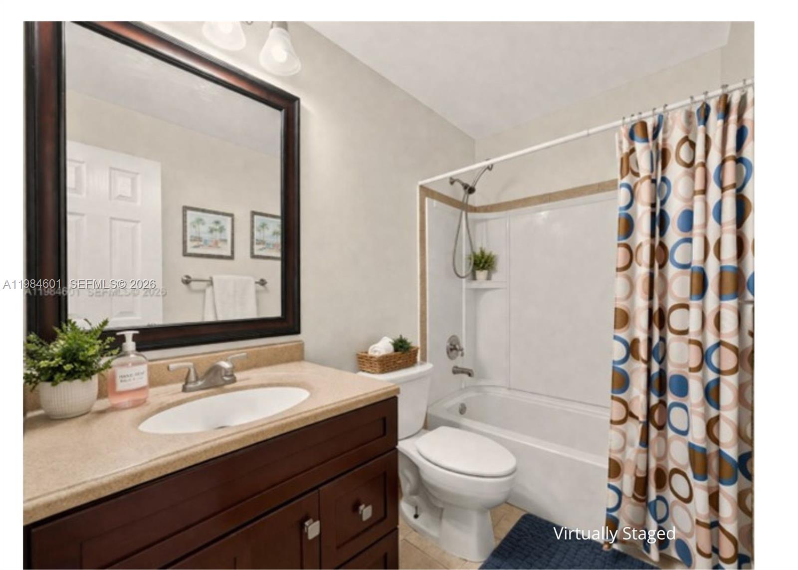 889 Hamilton Drive, Unit 889L Homestead, FL 33034 - Photo 20 of 28 a bathroom with a sink a toilet a shower curtain and a mirror