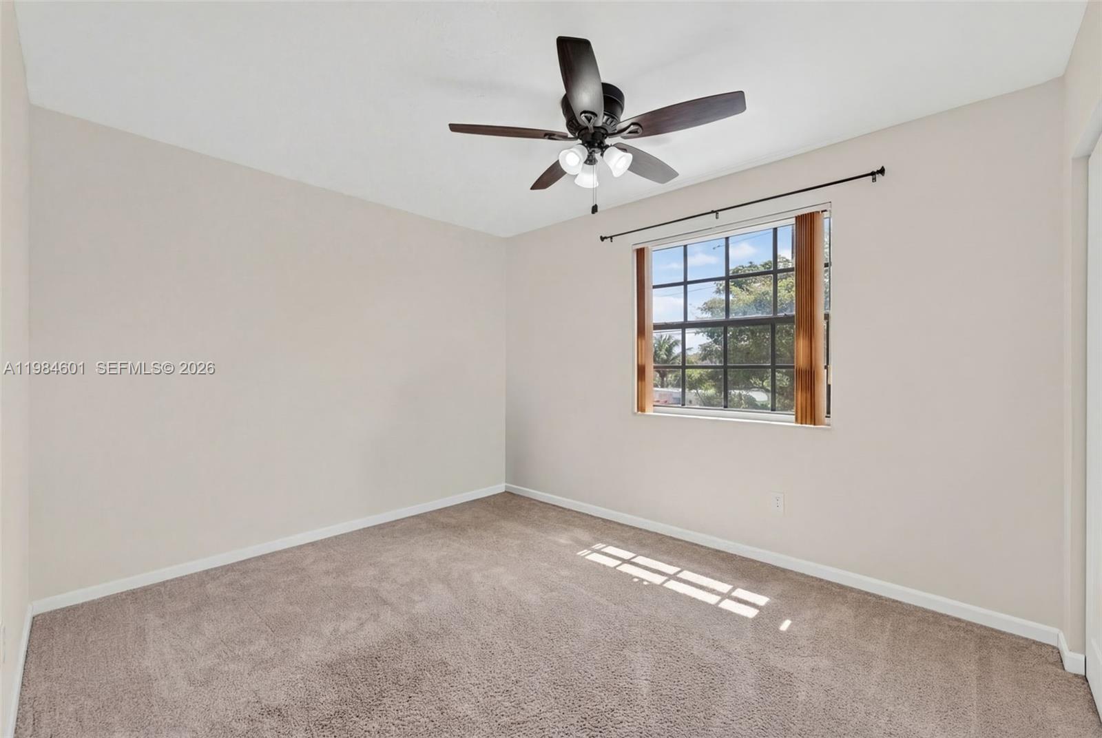 889 Hamilton Drive, Unit 889L Homestead, FL 33034 - Photo 21 of 28 a view of an empty room with a window