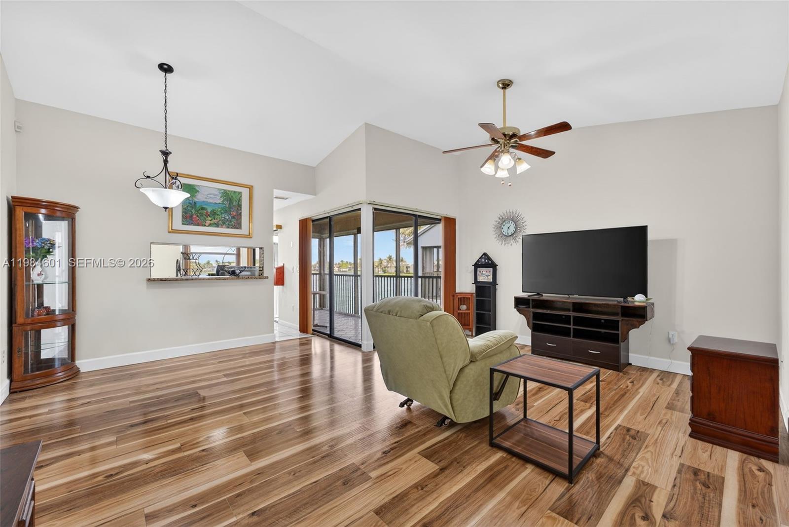 889 Hamilton Drive, Unit 889L Homestead, FL 33034 - Photo 6 of 28 a living room with furniture and a flat screen tv