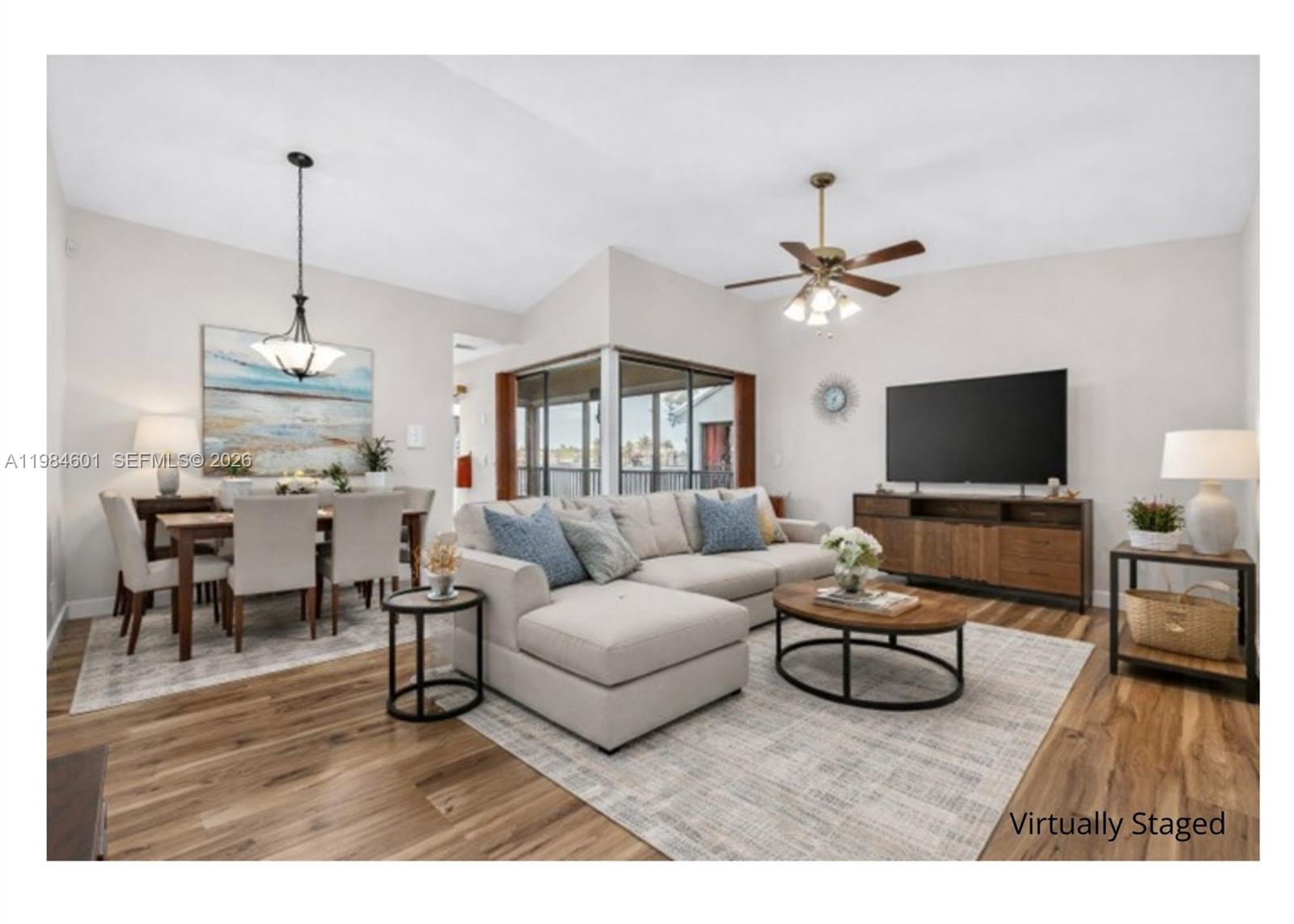 889 Hamilton Drive, Unit 889L Homestead, FL 33034 - Photo 7 of 28 a living room with furniture and a flat screen tv