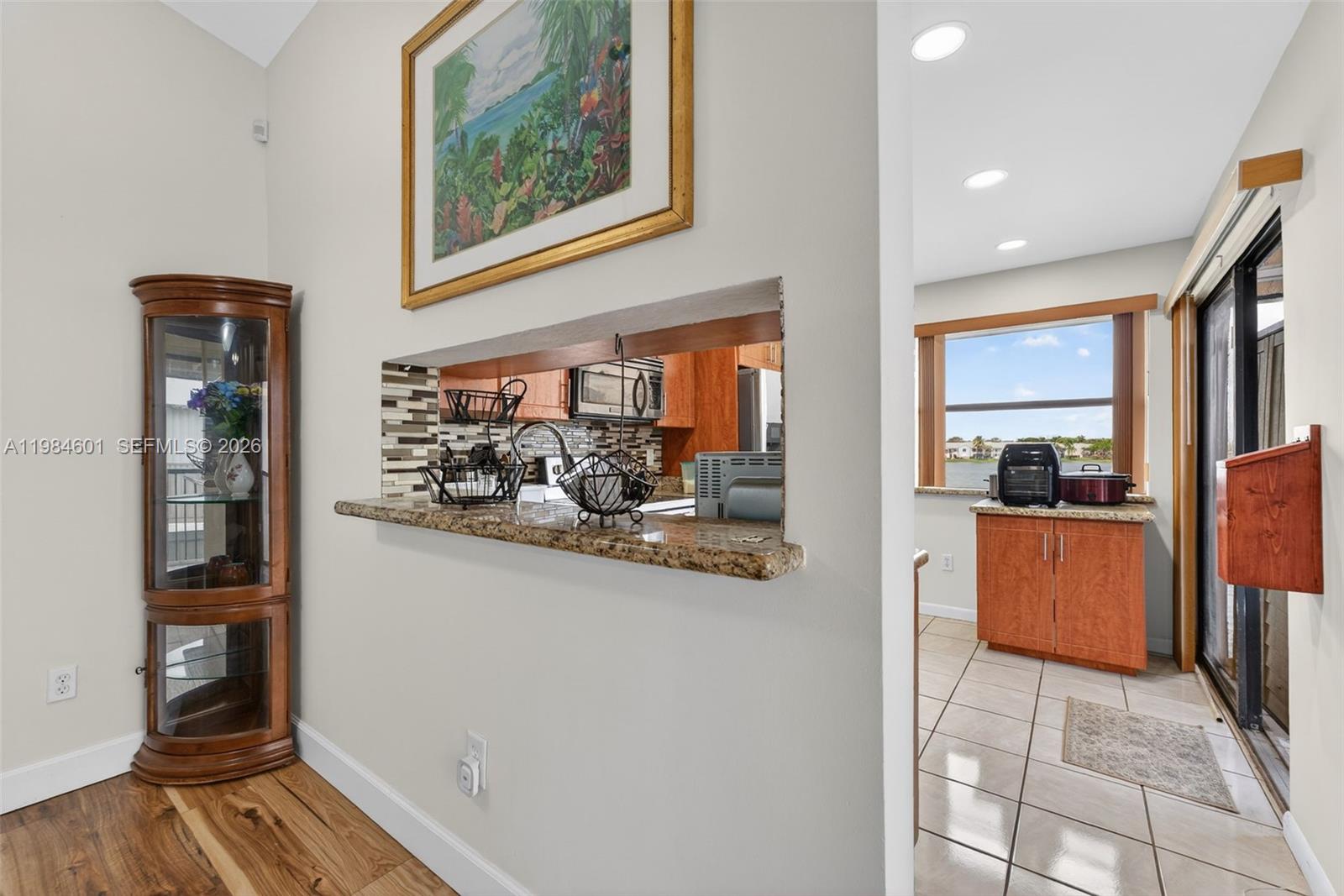 889 Hamilton Drive, Unit 889L Homestead, FL 33034 - Photo 10 of 28 a view of kitchen with furniture and wooden floor