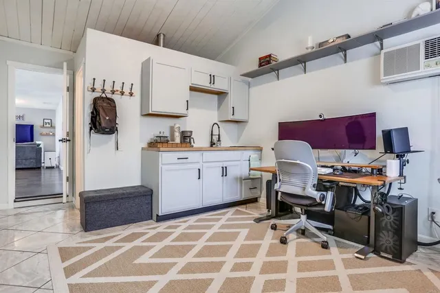 a bathroom with a sink and mirror