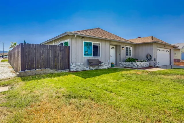 a view of a house with swimming pool in front of it
