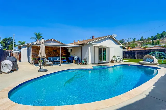 a view of a backyard with a tub