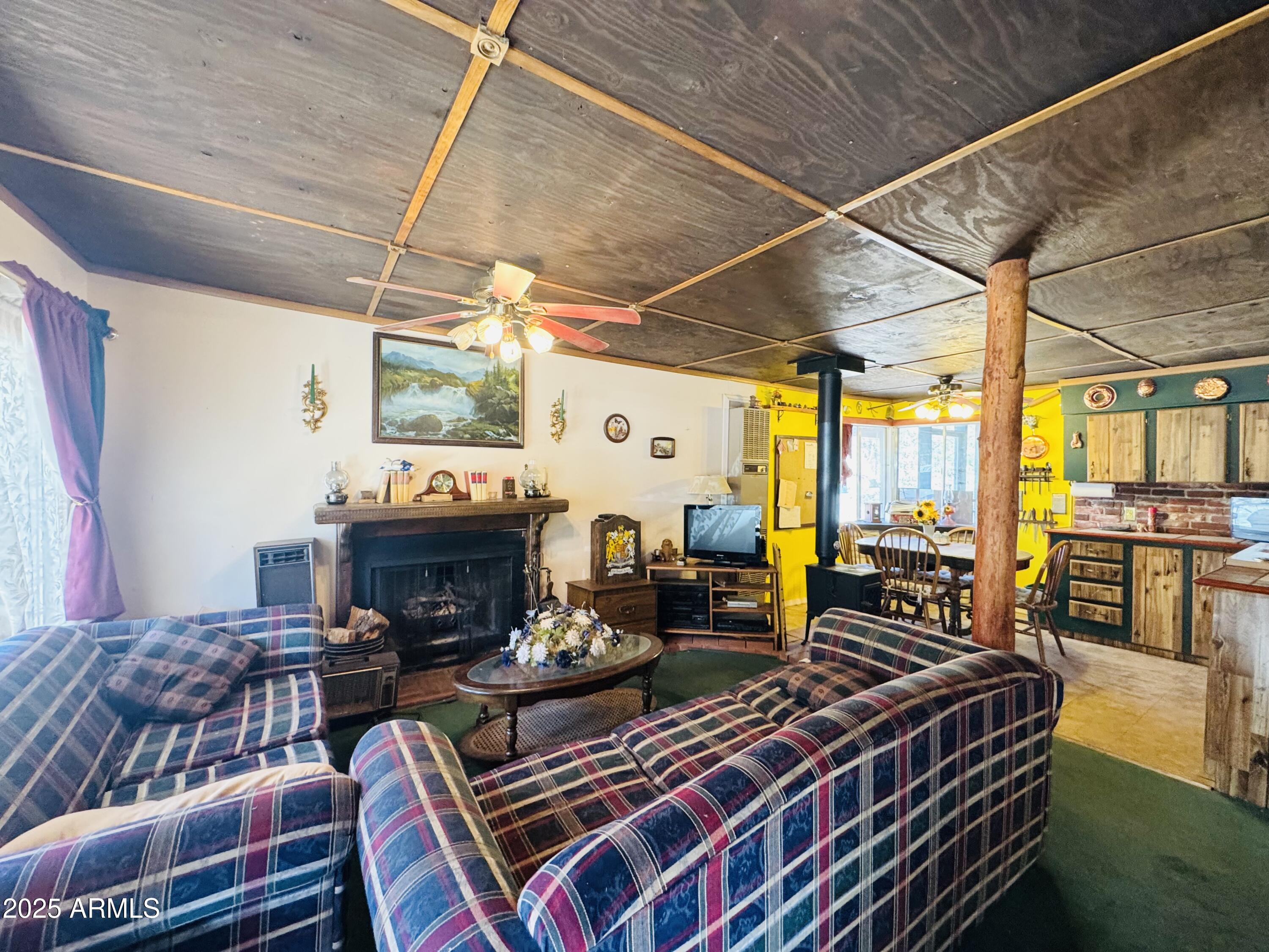 1241 Paint Pony Drive Payson, AZ 85541 - Photo 20 of 40 Living room wood fireplace