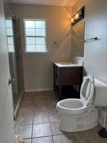 a bathroom with a toilet and a sink