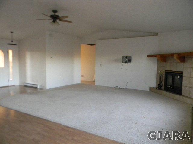 976 20 Road Fruita, CO 81521 - Photo 14 of 16 an empty room with a fireplace