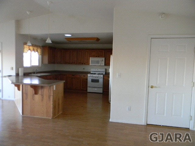 976 20 Road Fruita, CO 81521 - Photo 10 of 16 a kitchen with stainless steel appliances granite countertop a stove and a sink