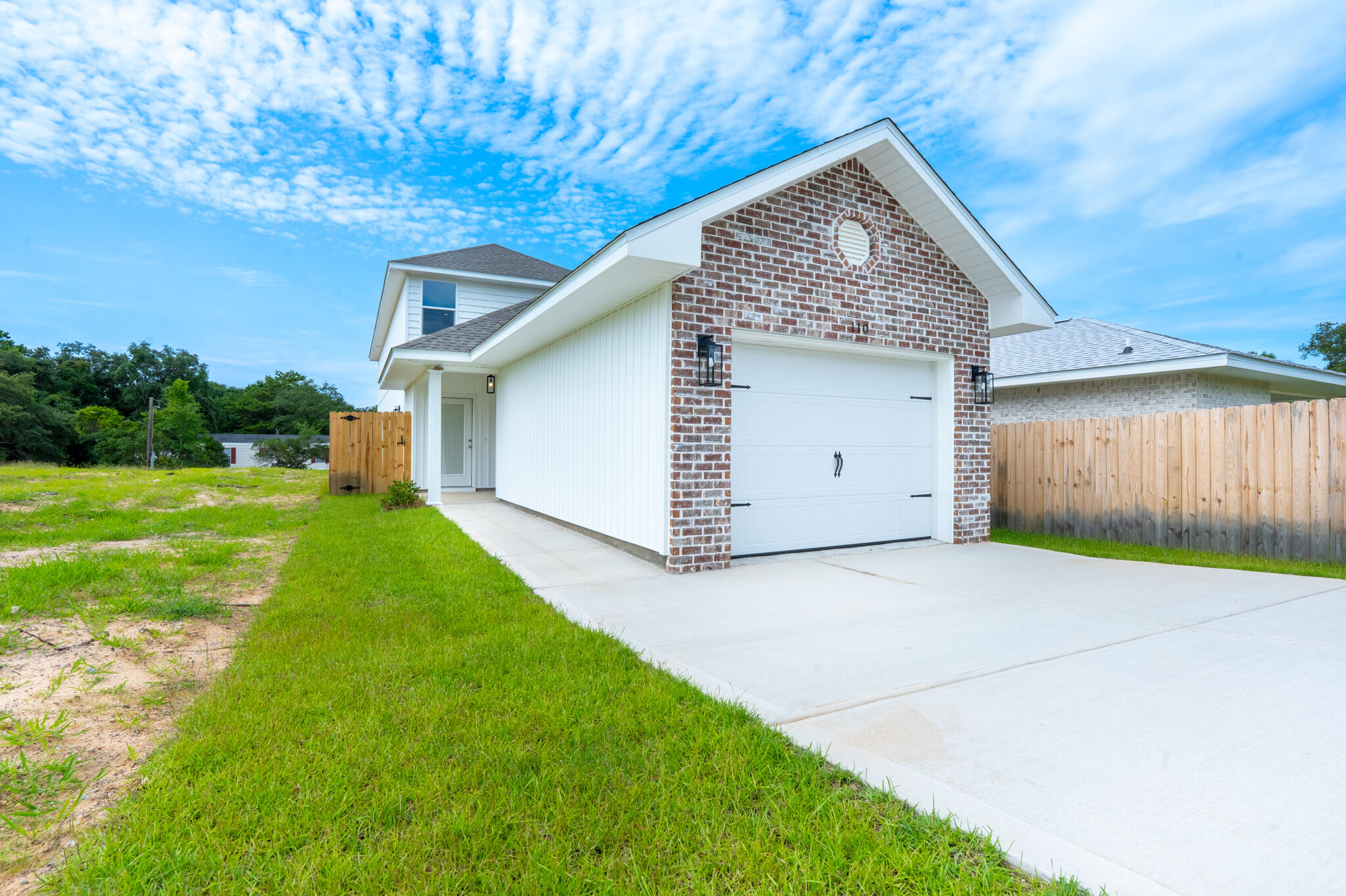 110 2nd Avenue Shalimar, FL 32579 - Photo 1 of 15 a front view of a house with garden