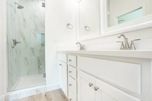 a bathroom with a sink and a mirror