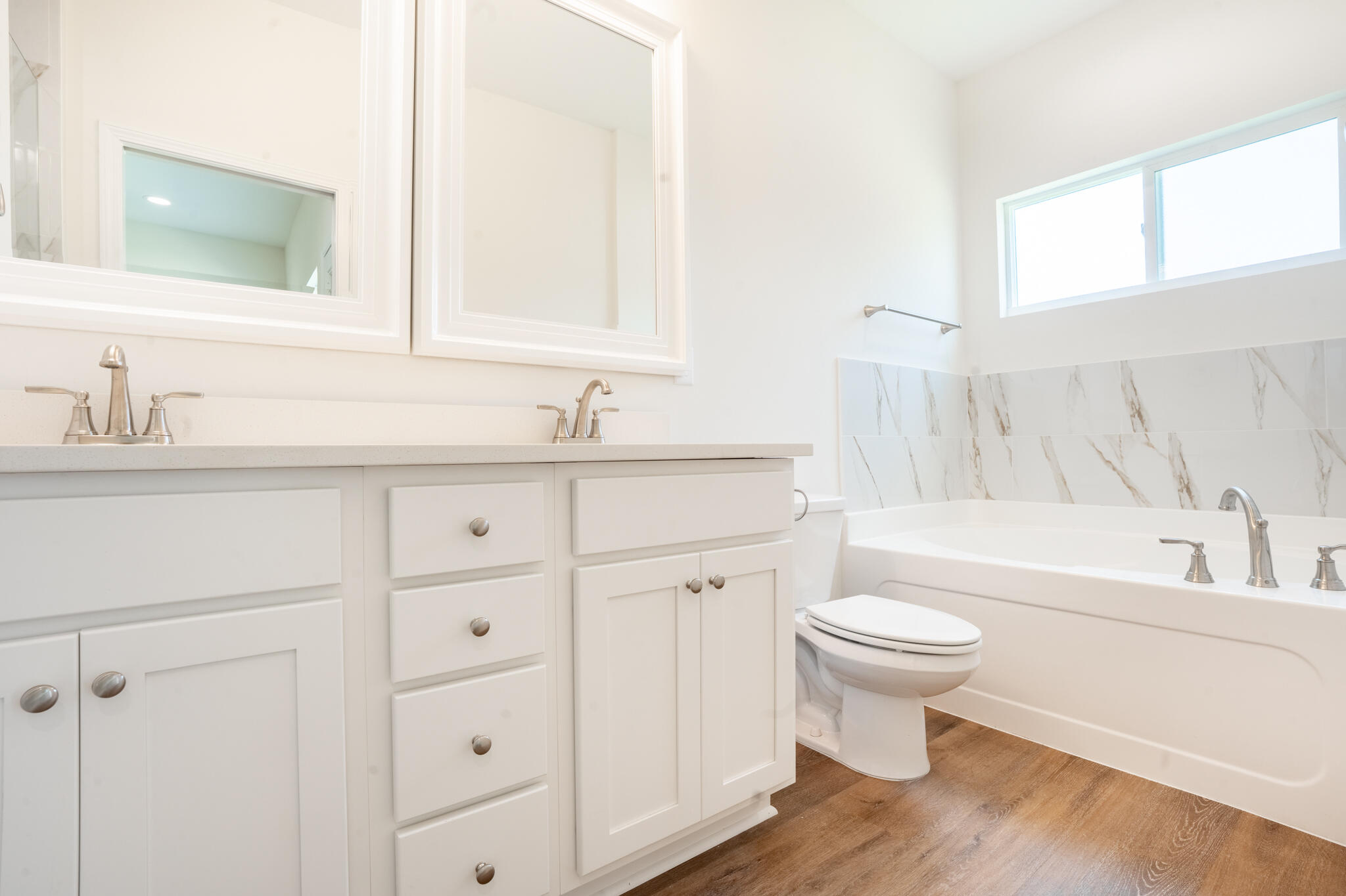110 2nd Avenue Shalimar, FL 32579 - Photo 13 of 15 a bathroom with a sink toilet a bathtub and a vanity