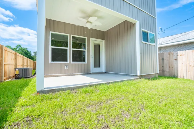 a view of a backyard with a garden and plants