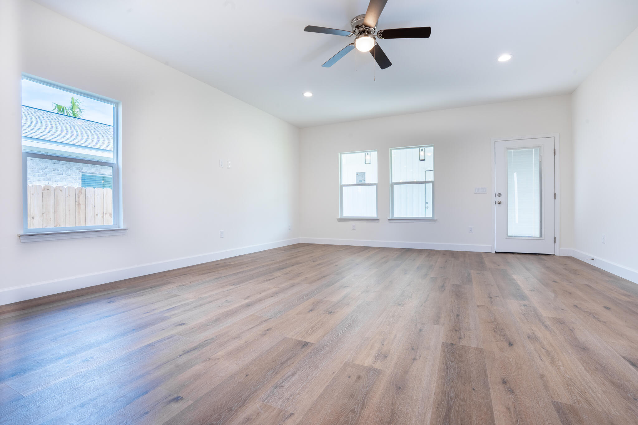 110 2nd Avenue Shalimar, FL 32579 - Photo 5 of 15 wooden floor in an empty room with a window