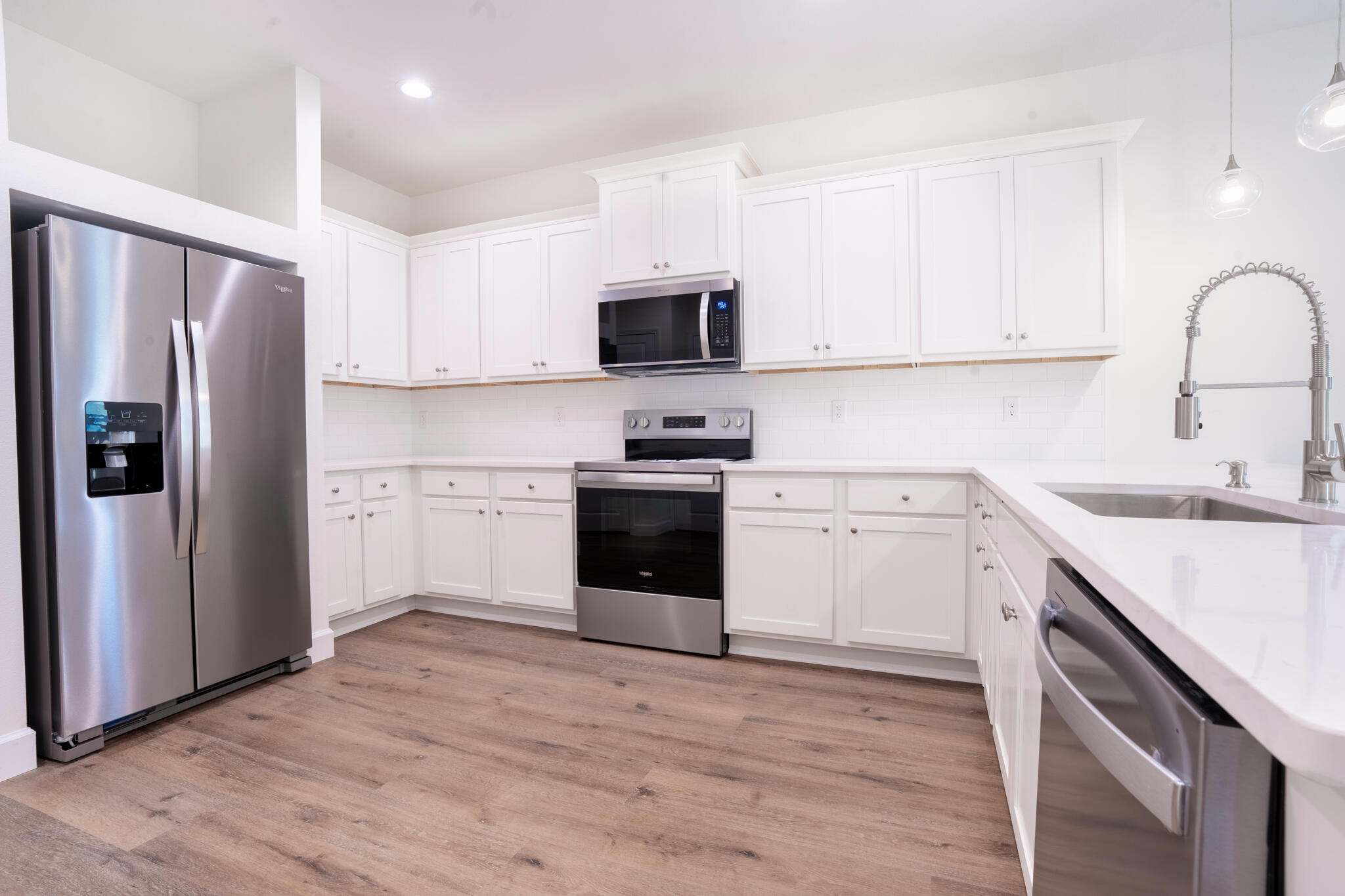 110 2nd Avenue Shalimar, FL 32579 - Photo 9 of 15 a kitchen with a sink stove and refrigerator