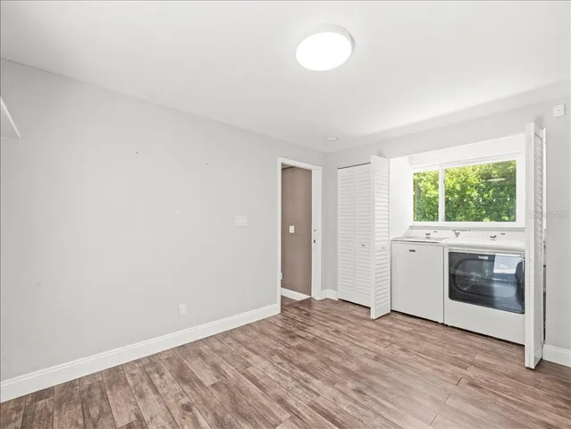 a view of a kitchen with a sink and a stove top oven