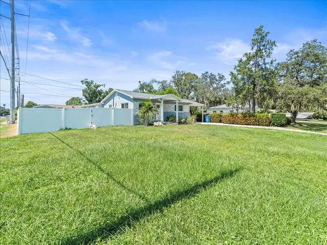 a view of a house with a big yard