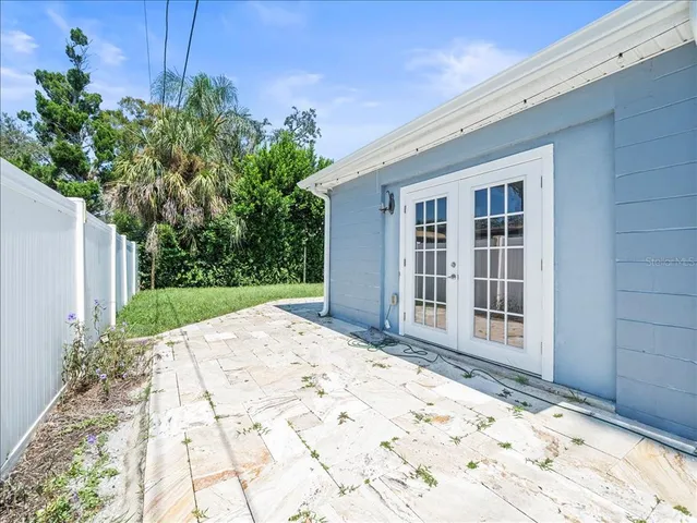 a view of a backyard of the house