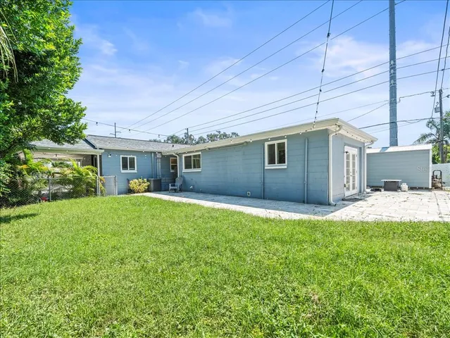 a house view with a sitting space and garden