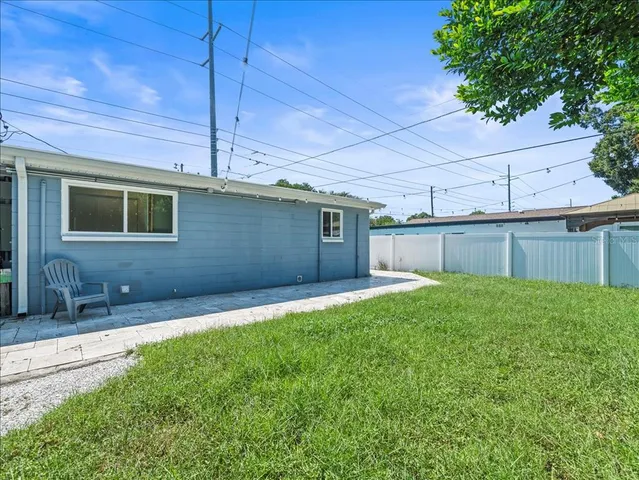 a backyard of a house with lots of green space