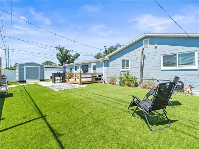 a house view with a seating space and garden