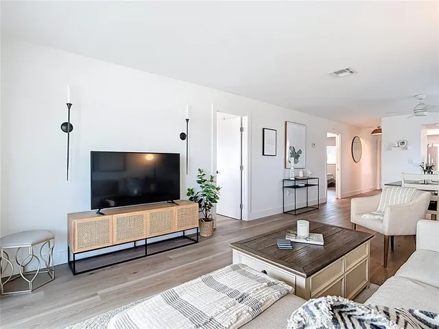 a vase of flowers sitting on a table with a vase of flowers sitting on a table