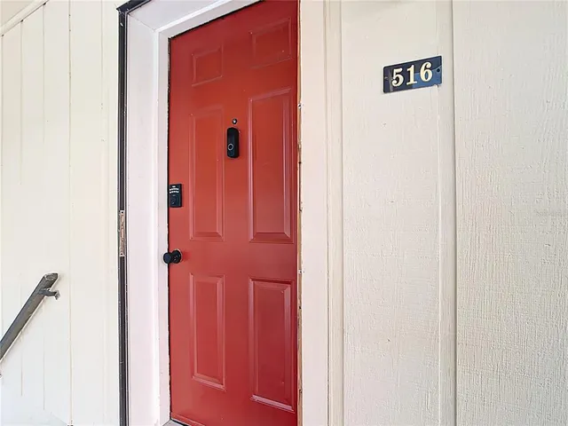 a living room with furniture floor to ceiling window and wooden floor