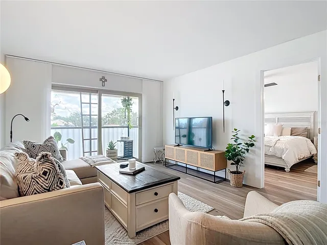 a kitchen with granite countertop a refrigerator and a sink