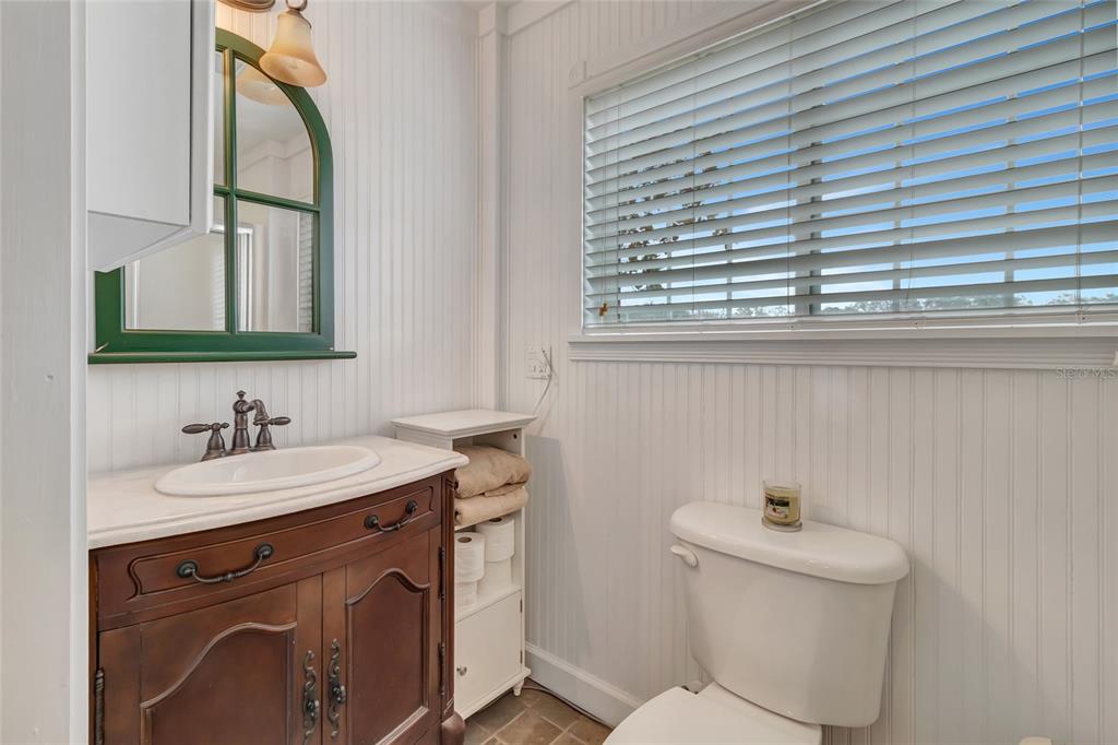 Wolf Branch Road Sorrento, FL 32776 - Photo 23 of 33 a bathroom with a toilet sink and mirror