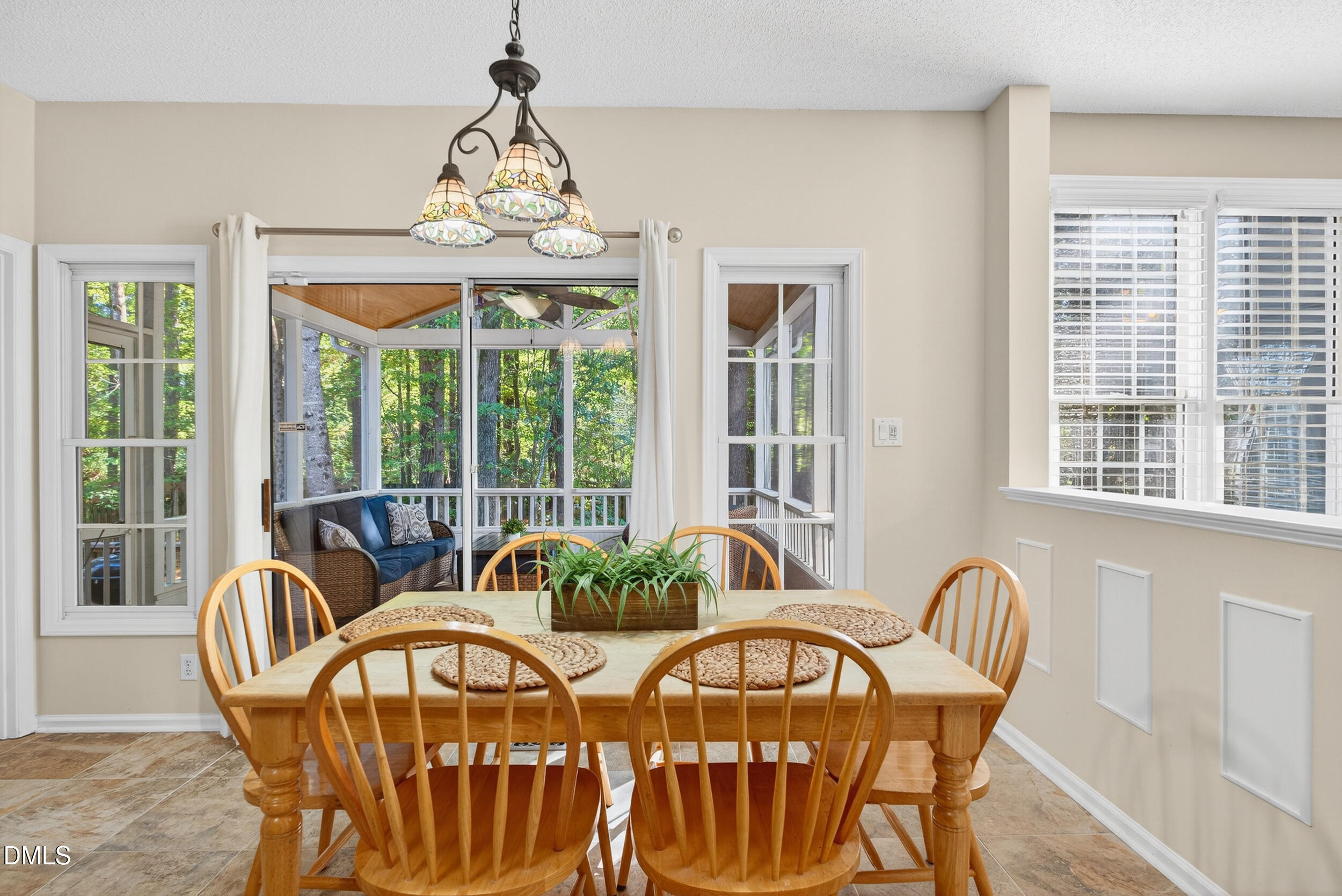 105 Point Harbor Drive Cary, NC 27519 - Photo 11 of 39 a view of a dining room with furniture large windows and wooden floor