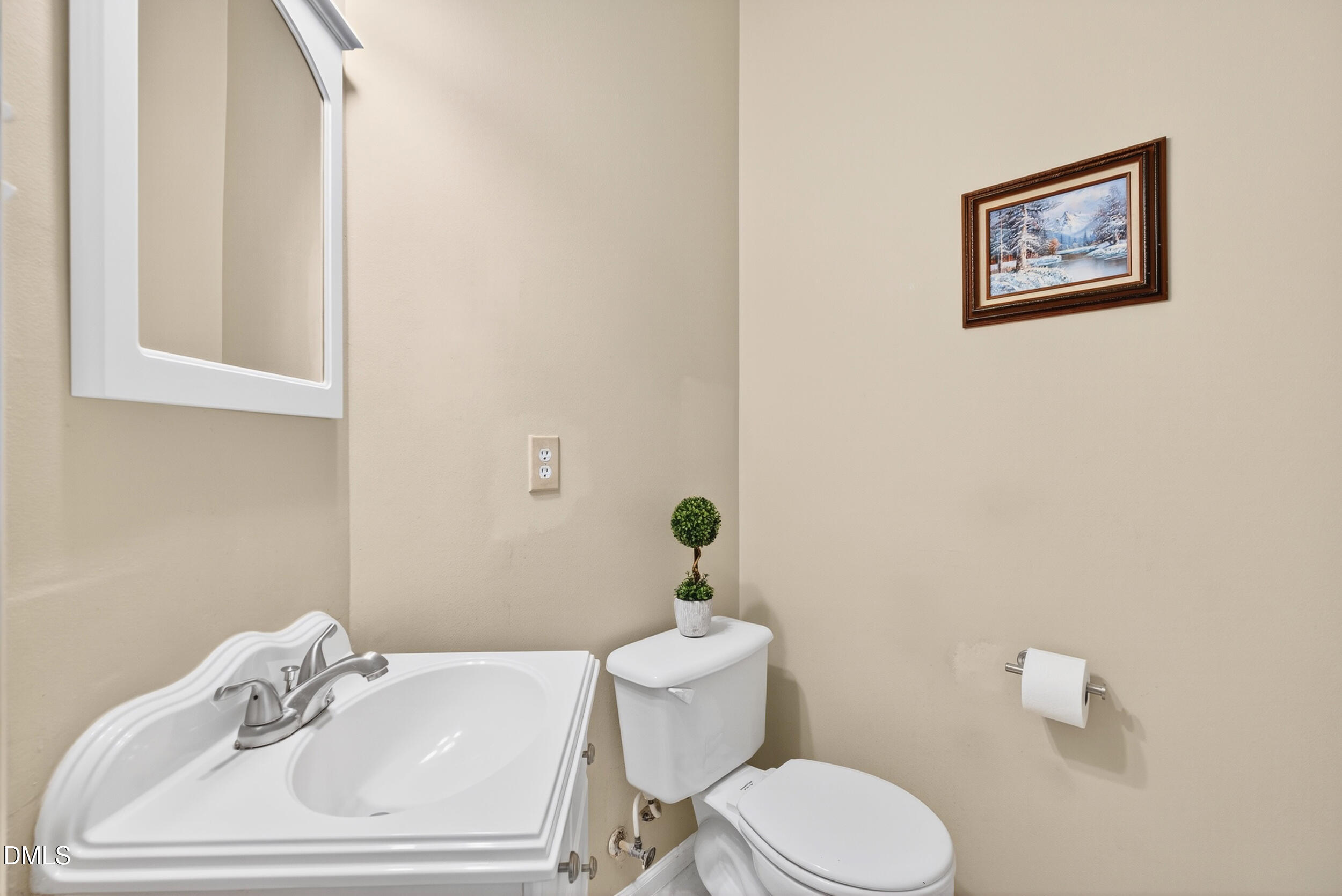 105 Point Harbor Drive Cary, NC 27519 - Photo 18 of 39 a bathroom with a sink mirror and toilet