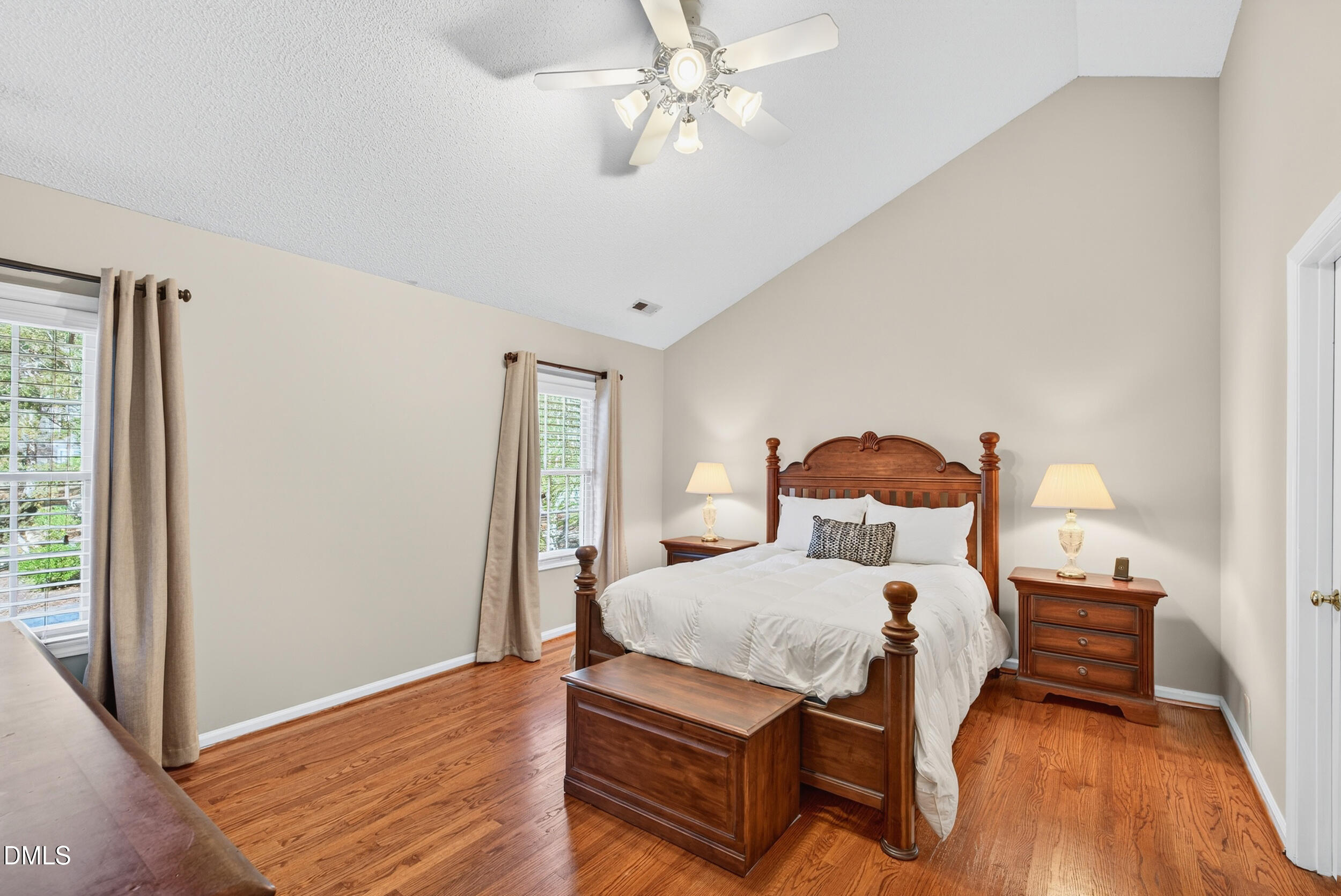 105 Point Harbor Drive Cary, NC 27519 - Photo 21 of 39 a bedroom with a bed and wooden floor