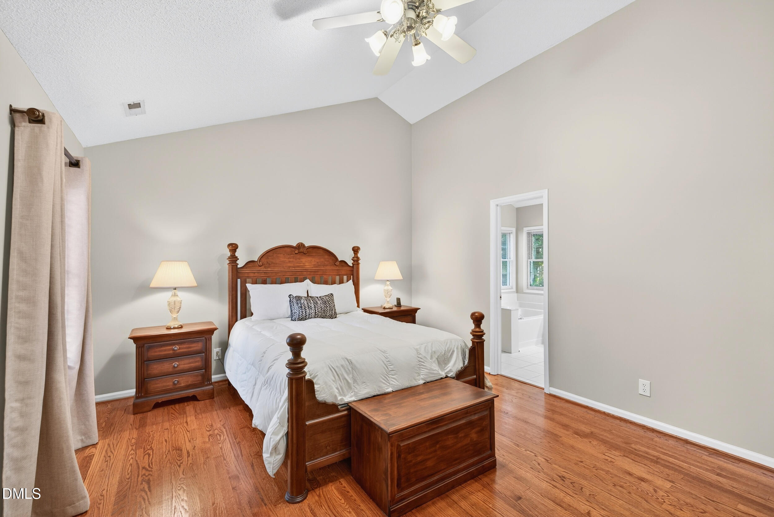 105 Point Harbor Drive Cary, NC 27519 - Photo 22 of 39 a bedroom with a bed and wooden floor