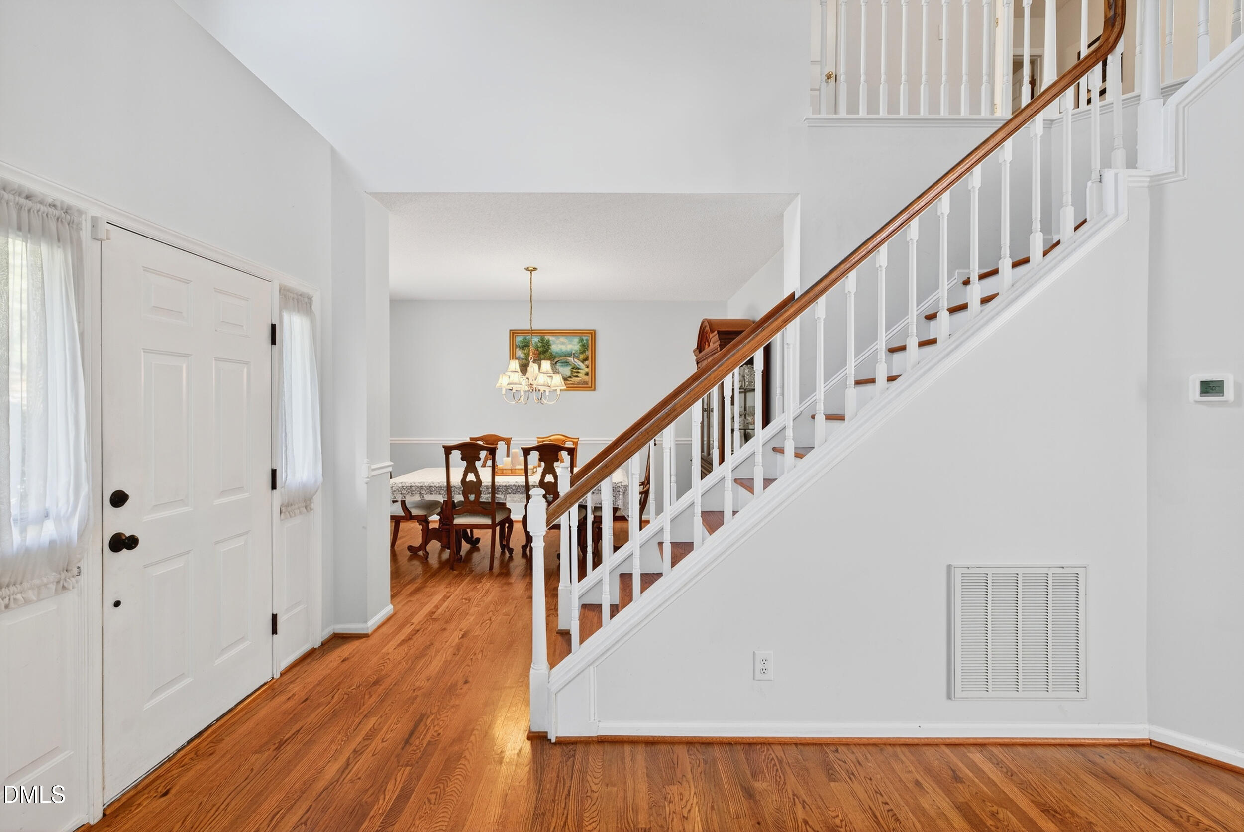 105 Point Harbor Drive Cary, NC 27519 - Photo 4 of 39 a view of entryway and hall with wooden floor