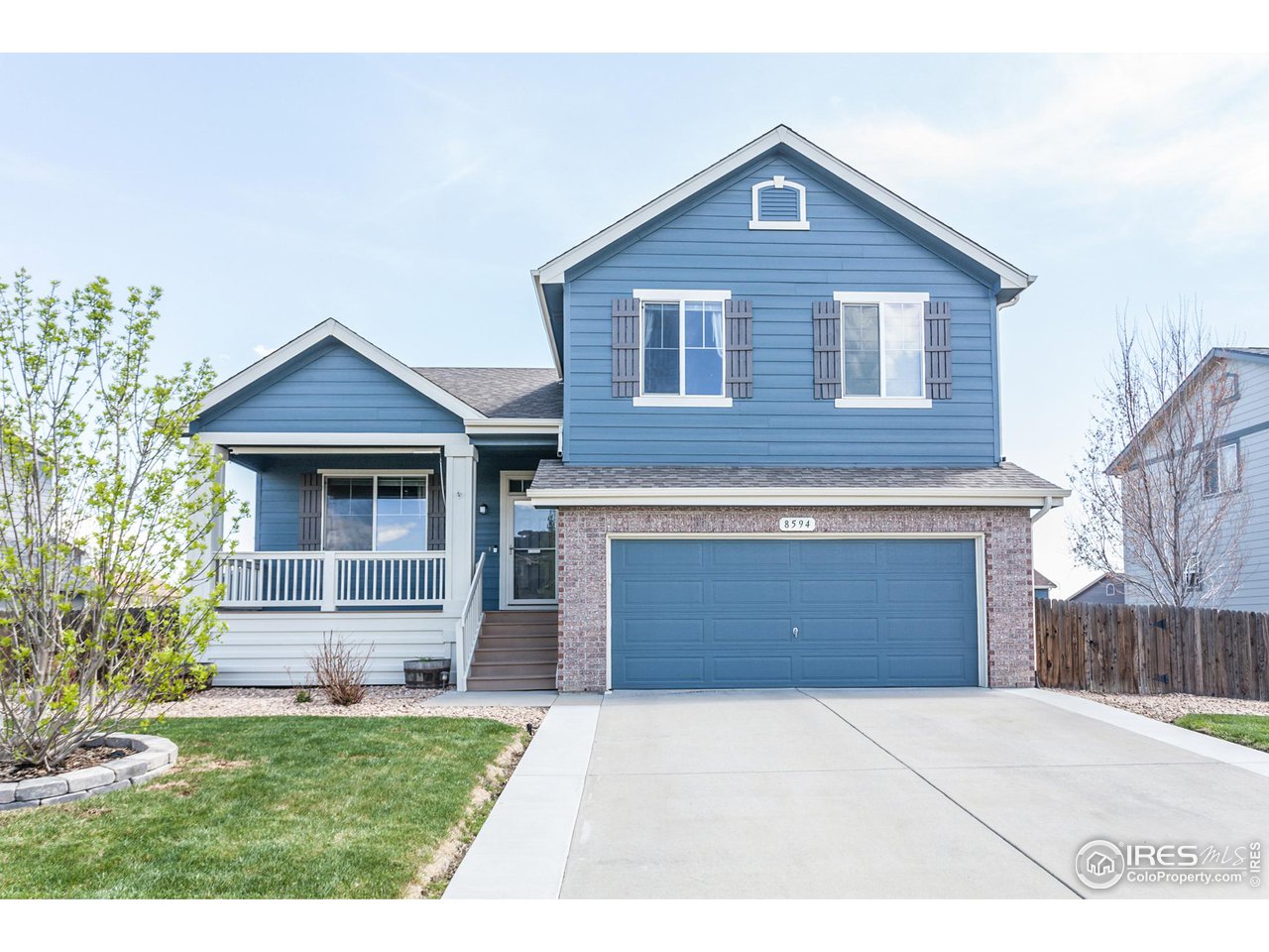 8594 Raspberry Drive Frederick, CO 80504 - Photo 1 of 40 a front view of a house with a yard and garage