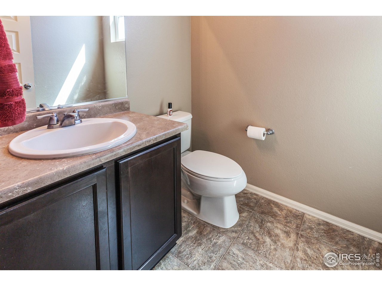 8594 Raspberry Drive Frederick, CO 80504 - Photo 19 of 40 a bathroom with a sink and a toilet