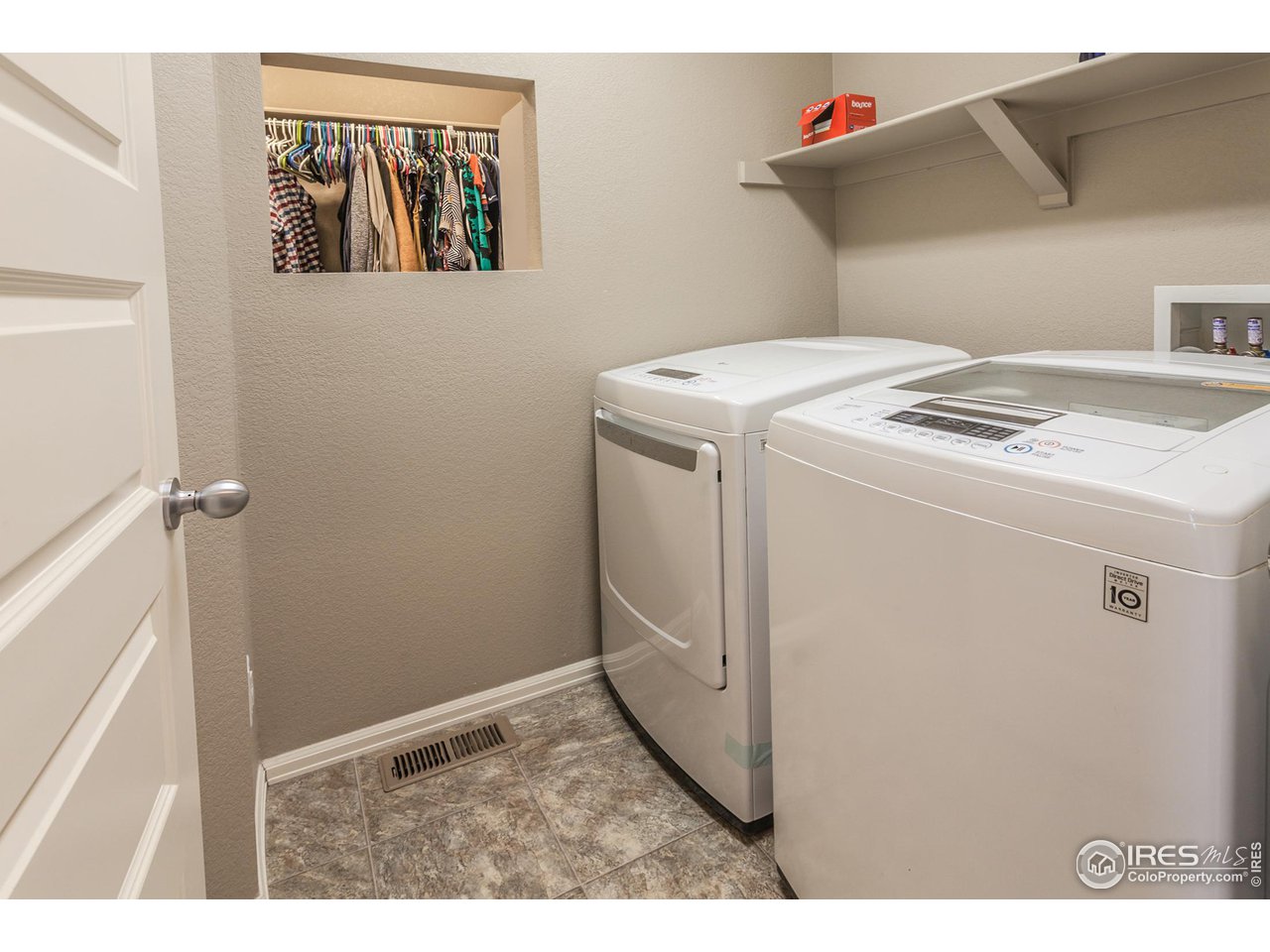 8594 Raspberry Drive Frederick, CO 80504 - Photo 22 of 40 a utility room with dryer and washer